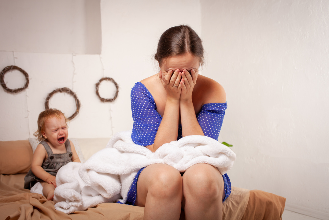 Tired Mother Irritated by Her Screaming Baby